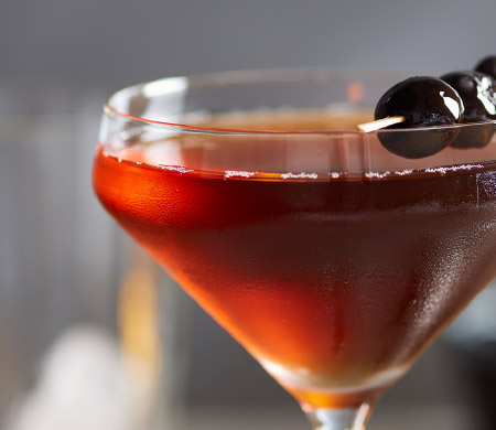 A close up of a cocktail in a coupe glass